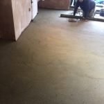 man smoothing floor